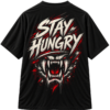 Black VX MERCH T-shirt featuring a graphic of a snarling beast with red eyes and the text STAY HUNGRY in a bold, distressed white font.