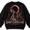 20261001104238-1f1bd84d-2265-6b44-9911-e2416409f8fa.png Black VX MERCH sweatshirt featuring a gothic archway, red eclipse, and text reading Light Leaves Last, Stay After The Signal, VX Merch Worldwide.