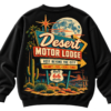 Black streetwear sweatshirt featuring a retro Desert Motor Lodge graphic with a Route 66 sign, cactus, and full moon in a vintage desert aesthetic.